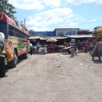 Hustle and Bustle at the Bus Depot, view of the bus depot outside the municipal market in Masaya