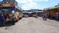 Hustle and Bustle at the Bus Depot, view of the bus depot outside the municipal market in Masaya